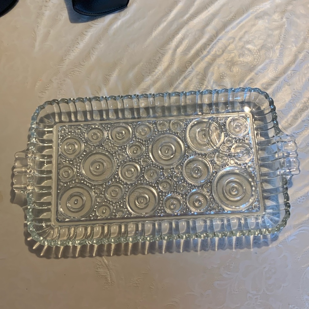 Really pretty glass dish with circle pattern.